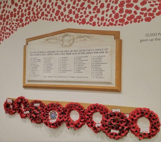 A memorial wall with poppy wreaths and a large framed plaque, dedicated to the men of the General Post Office who gave their lives in the First World War.