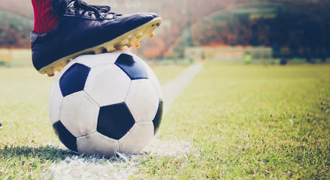 football-soccer-boot-on-ball-pitch