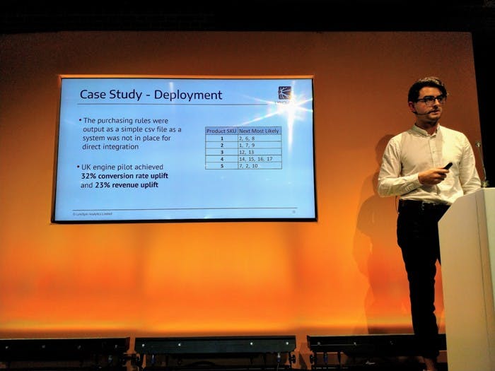 Nick Mottershead of Lynchpin Analytics stands in front of a slide detailing the output and results of the cast study.