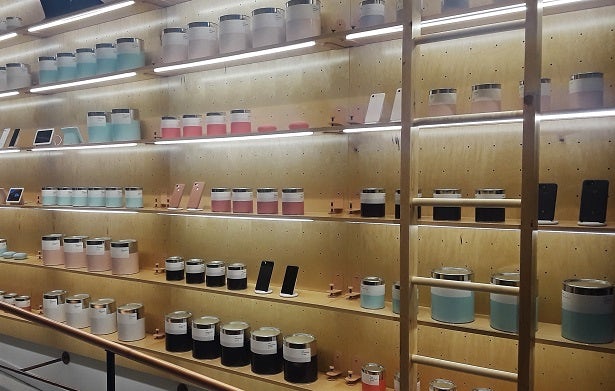 Rows of pretend paint cans sit next to smartphones and tablets inside Google's Hardware pop-up.