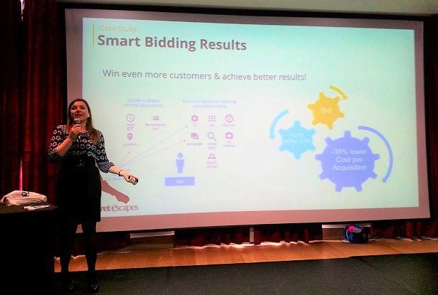 Rumyana Miteva speaks in front of a presentation slide at the Leaders in Travel Marketing event.