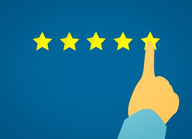 Five gold stars against a blue background, with a finger pointing to the last star.