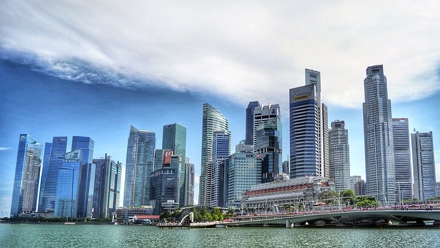 Photograph of the Singapore skyline, with skyscrapers lining the harbour.