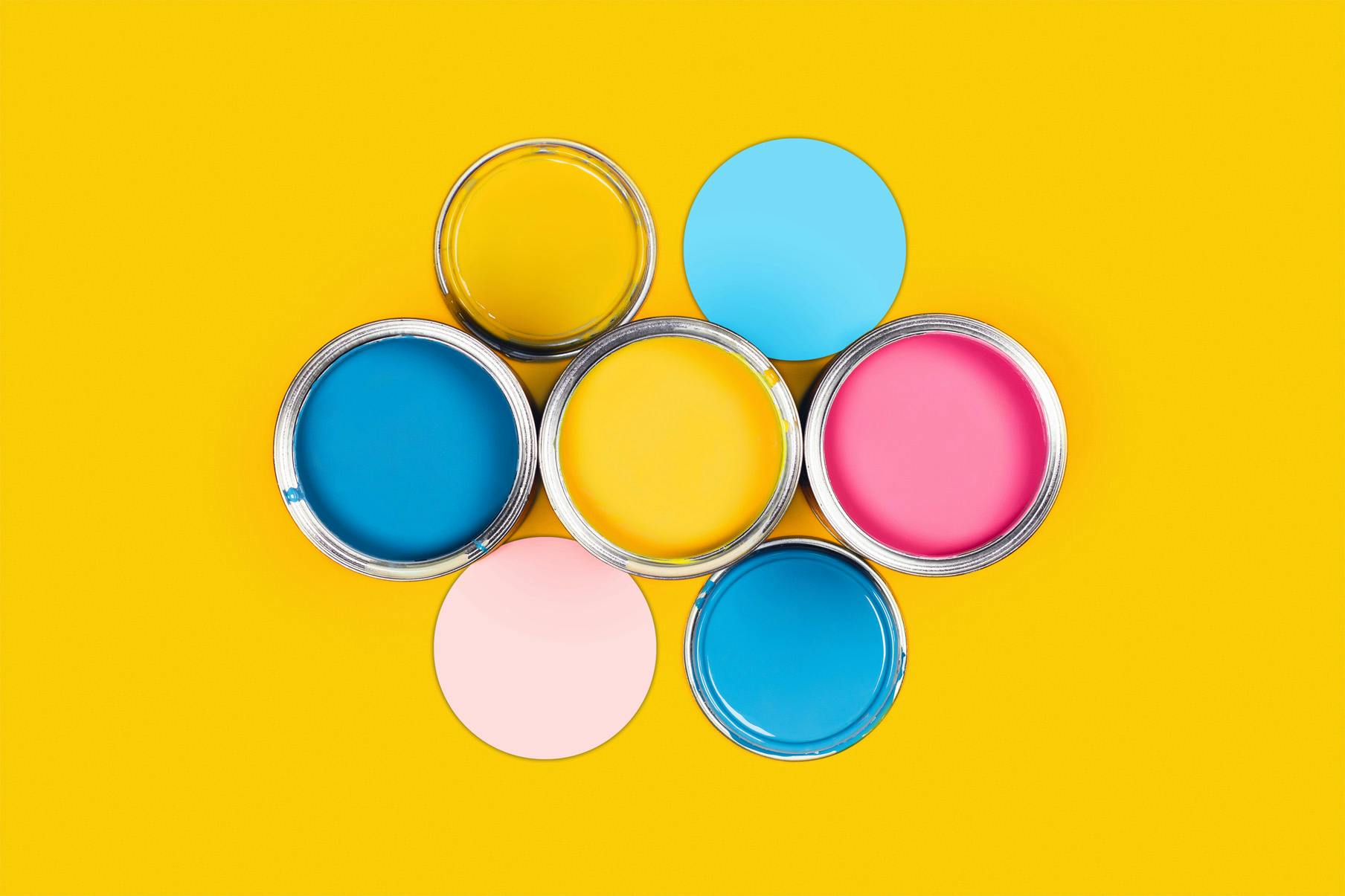 Multicoloured tins of paint arranged in hexagonal formation