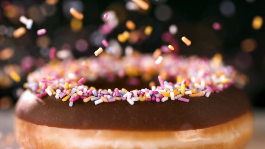 krispy kreme chocolate doughnut with sprinkles
