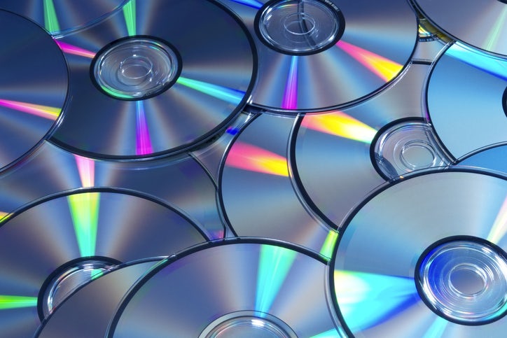 High angle view and blue tinted image of DVDs