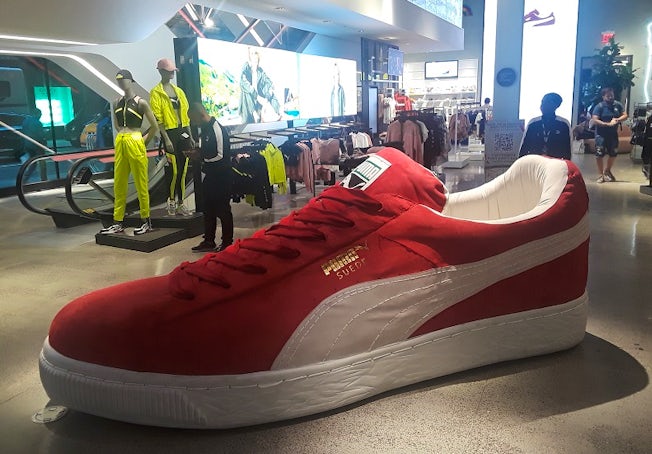 A giant suede classic sneaker inside the Puma flagship store.