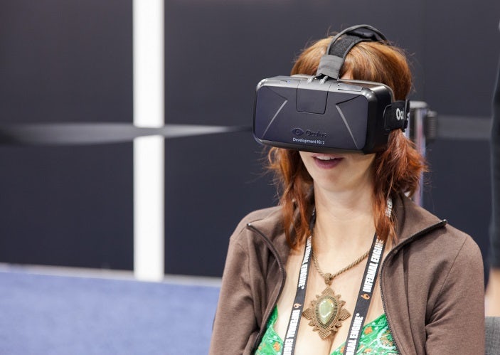 A woman wearing an Oculus Rift headset