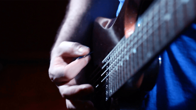 guitar being strummed