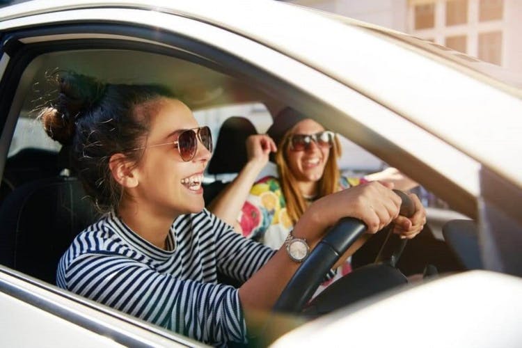 Two Young Women Driving