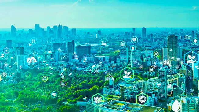 Stock imagery of a city overlaid with icons representing sustinability, e.g. trees, a hand cupping a seedling, a recycling symbol, a globe with a leaf curled around it, etc.