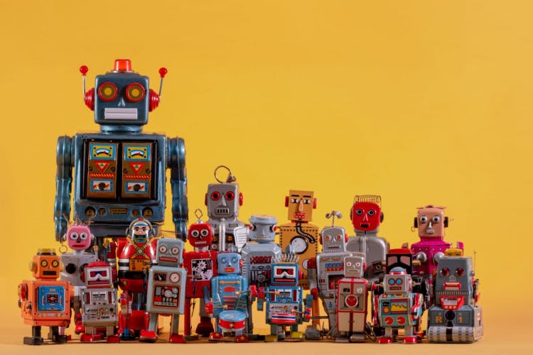selection of toy robots on a yellow background