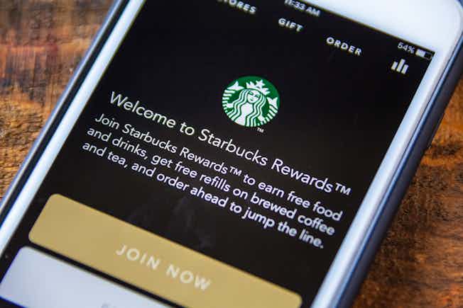 Smartphone displaying the Starbucks Rewards loyalty programme on its screen.